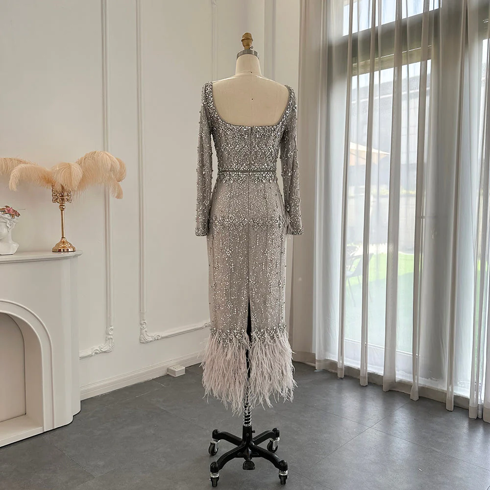Second image of Elegant Silver Sequin Evening Dress with Feather Hem – Long Sleeve