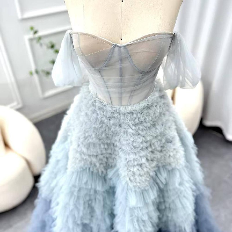 Second image of Elegant Layered Blue Ruffle Ball Gown with Sheer Corset Bodice