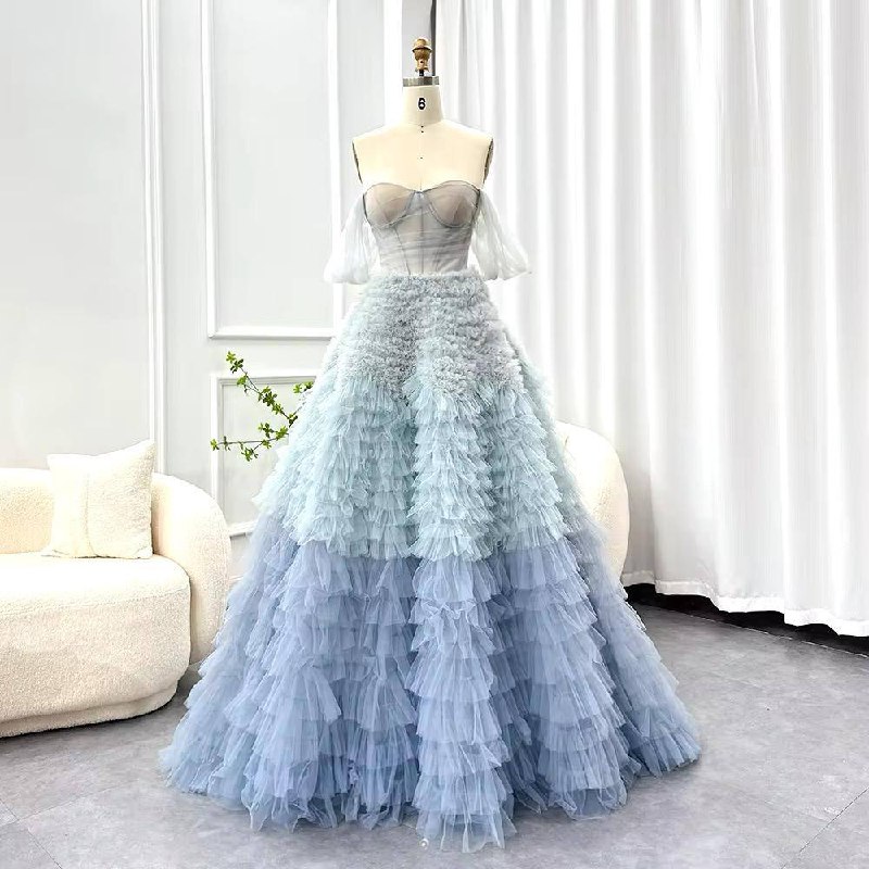 Elegant Layered Blue Ruffle Ball Gown with Sheer Corset Bodice