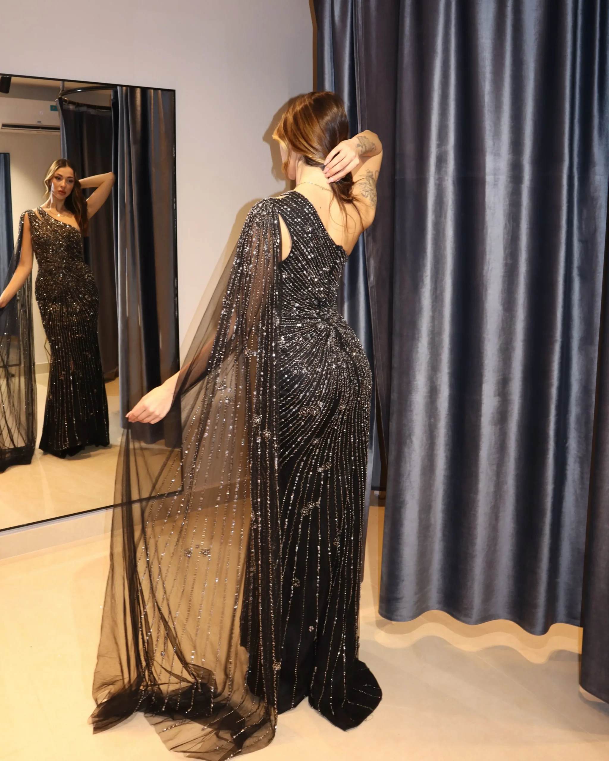Second image of Black One-Shoulder Sequin Evening Gown with Sheer Cape Sleeve