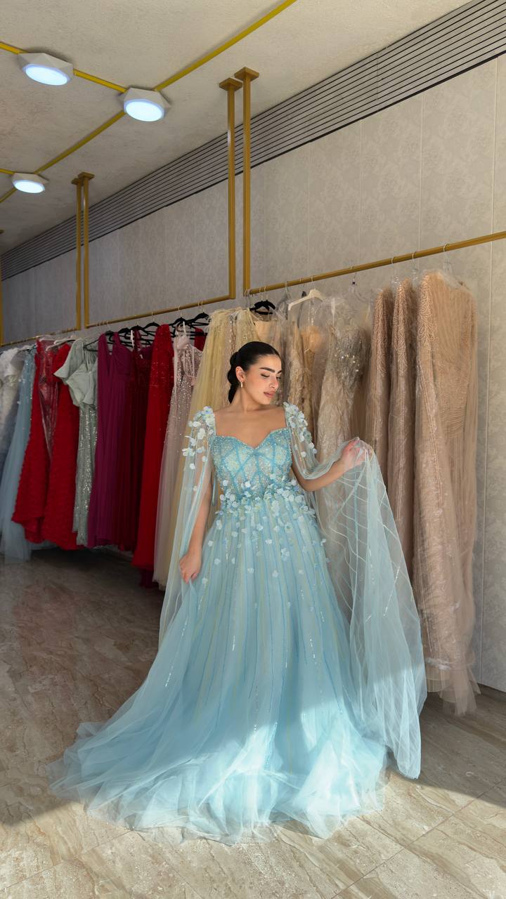 Second image of Sky Blue Embellished Princess Gown with Sheer Cape Sleeves