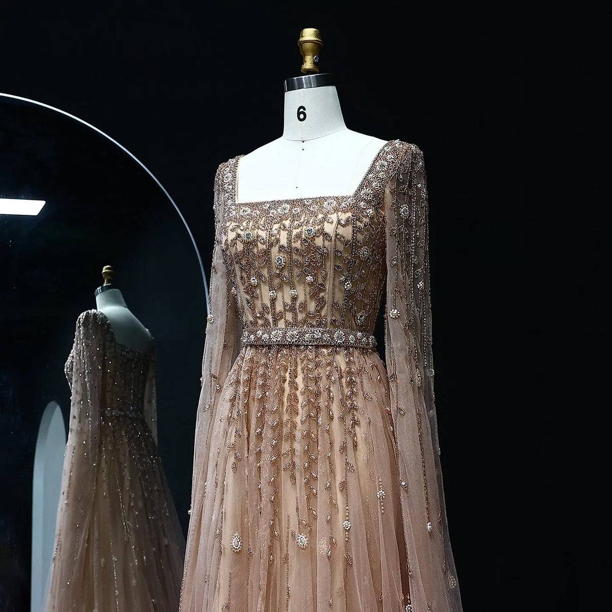 Second image of Gold-Sand Starburst Beaded Gown with Integrated Floor-Length Cape Sleeves