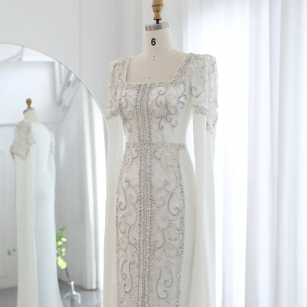 Second image of Ivory Celestial Column Gown with Square Neck and Draped Cape Sleeves